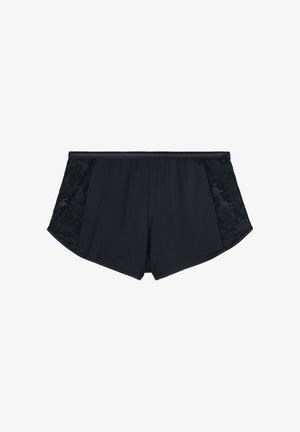 Shorts noirs en tissu lisse avec des panneaux en dentelle sur les côtés. Le design comprend une large taille élastique et une coupe évasée.