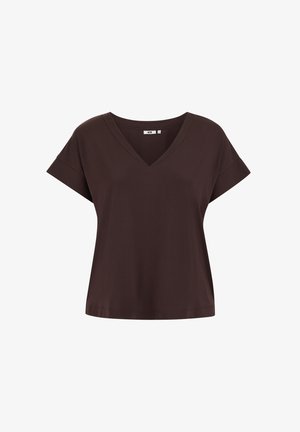 Brūna īsroku krekla ar V-veida izgriezumu, izgatavota no mīksta kokvilnas auduma maisījuma. Raksturo to brīvā piegriezuma un vienmērīga tekstūra visā virsmā.