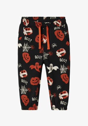 Zwarte sweatpants met een Halloween-patroon van pompoenen, spoken, spinnen en webben in rood, wit en oranje, met een elastische tailleband en zakken.