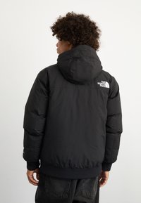 The North Face MCMURDO  - Jachetă cu puf - black