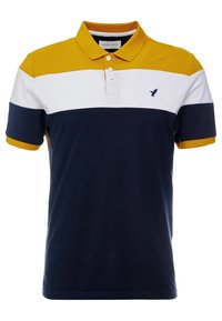 Polo à manches courtes avec col moutarde, blocs de couleurs horizontaux blanc et marine, deux boutons blancs et petit logo oiseau sur la poitrine.