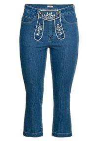 Denim jeans med ankellängd i mörkblått med broderade blommönster på midjebandet. Har fem fickor och en skräddarsydd silhuett.