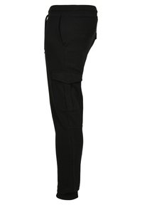 Zwarte cargo broek gemaakt van een zachte katoenmix, met een taps toelopend ontwerp, zijzakken en een elastische tailleband met trekkoord.