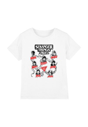 White T-shirt featuring black-and-red graphic of "Stranger Things Tales from '85" with illustrated faces and names of seven main characters.