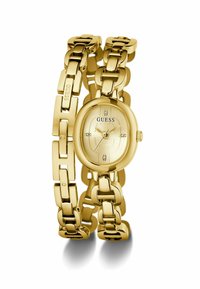Orologio Gold Guess con cassa ovale, bracciale metallico dorato e quadrante testurizzato con accentuazioni in cristallo e indici neri.