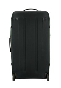 Hard-shell suitcase in dark green and black, featuring vertical grooves, a top handle, and dual wheels for mobility.