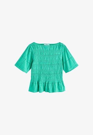 Turquoise short-sleeve blouse with smocked bodice, eyelet detailing, and a gathered peplum hem.
