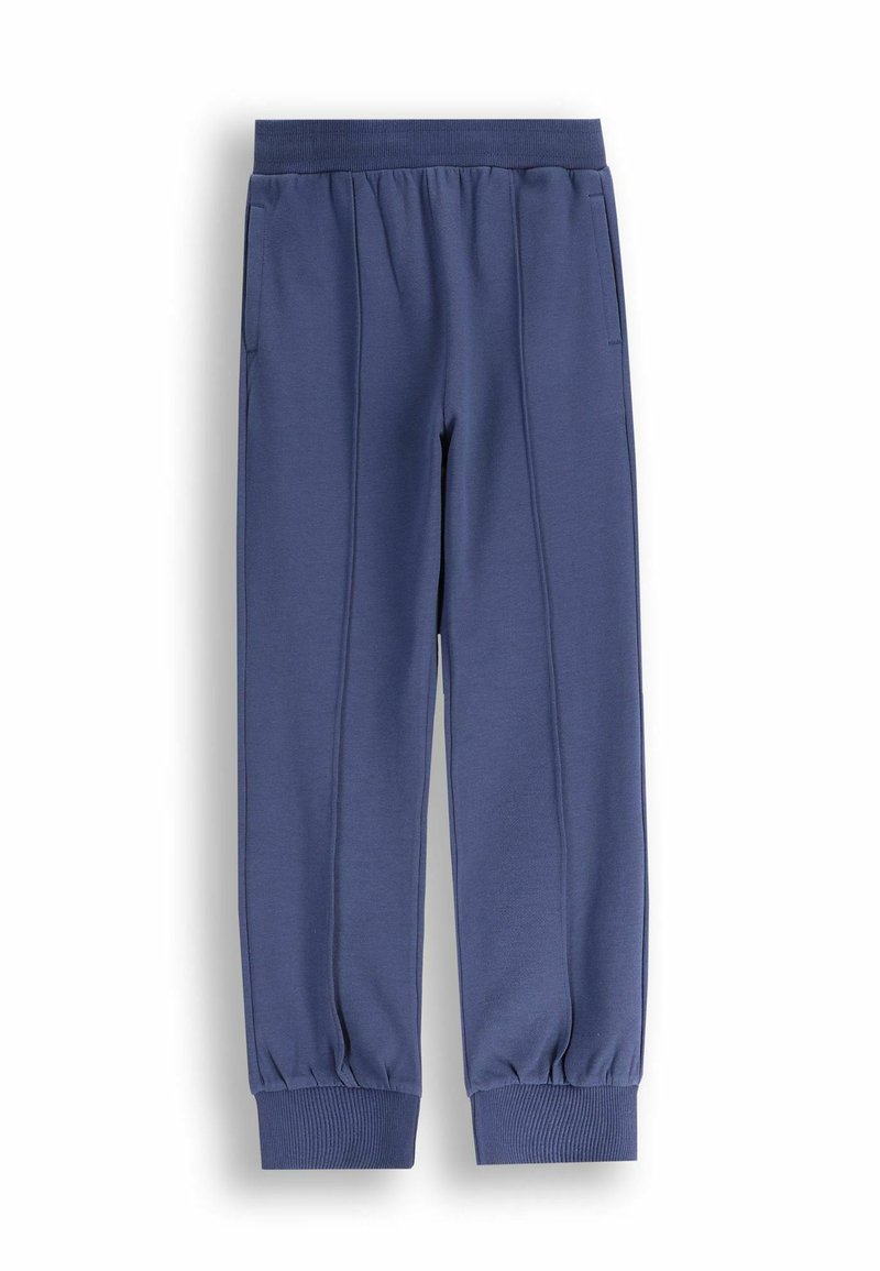 Niebieskie dresowe spodnie z bawełny z elastycznym paskiem w talii, bocznymi kieszeniami i ściągaczami przy kostkach, wyłożone płasko na białym tle.