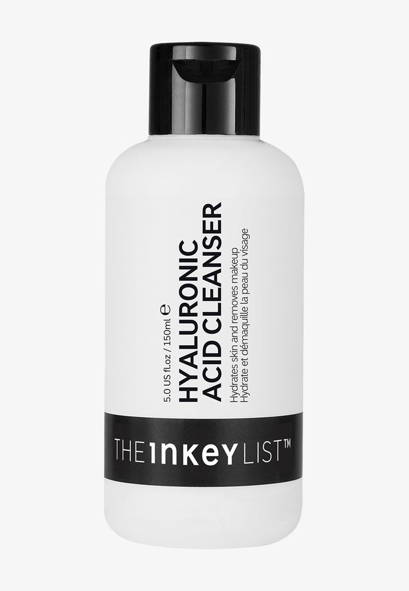 Limpiador de Ácido Hialurónico en una botella de plástico blanca con una tapa de bomba negra. Texto negro en el frente muestra el nombre del producto y detalles de uso.