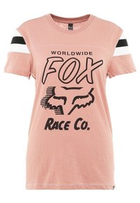 Rosa bomull t-shirt med svart grafisk text "WORLDWIDE FOX RACE CO." och en räv-logotyp. Kortsleeves med vita och svarta ränder.