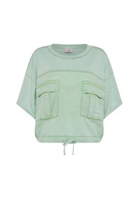 Krótki top z krótkim rękawem w jasnozielonym kolorze, wykonany z bawełny, z dwoma kieszeniami z przodu i ściągaczem na dole. Gładka tekstura i luźny krój.