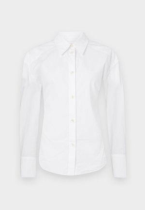 White button-up shirt made of cotton. Features a classic collar, long sleeves, and standard button placket with beige buttons. Smooth texture.
