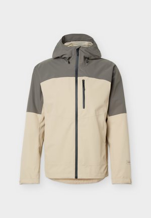 Giacca impermeabile color beige e verde oliva con cappuccio, tasca con zip sul petto e chiusura frontale con zip a tutta lunghezza.