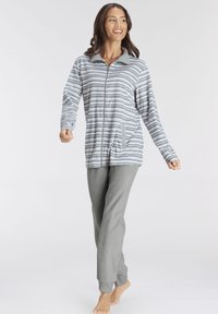 Light gray and white striped zip-up top with pockets, paired with solid gray pants featuring cuffs. Soft fabric, relaxed fit, and long sleeves.