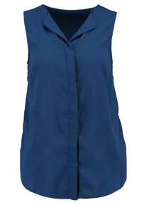 Blouse sans manches bleu marine avec un col en V et une patte de boutonnage frontale dissimulée, fabriquée en tissu lisse.
