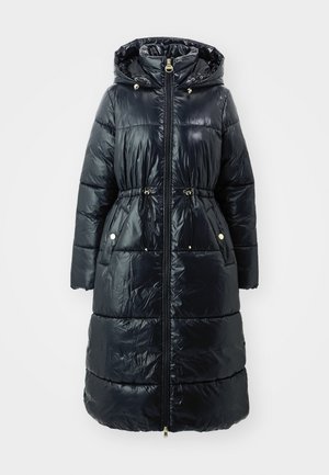 Puffer coat in dark navy with a hood, featuring quilted sections, side pockets, drawstring waist, and gold-tone hardware accents.