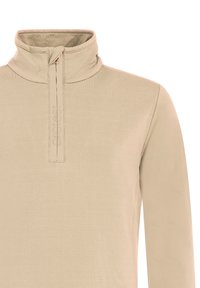 Béžový pulóver s dlhým rukávom a stojacím golierom, s polovičným zipsom vpredu. Má hladkú textúru a jemný detail loga na zips.