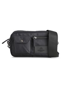 Black fabric crossbody bag with a zippered main compartment, front flap pocket, additional zippered pocket, and leather accent label.