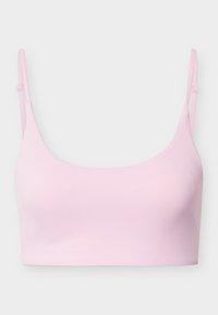 Ροζ ανοιχτό ροζ χωρίς ραφές bralette με λεπτές ρυθμιζόμενες τιράντες και ομαλό, απλό σχέδιο.