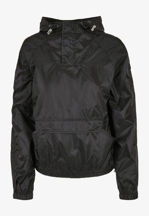 Must musta kapuutsiga jope, millel on eesmine tasku, elastsed mansetid ja reguleeritav nöör. Valmistatud siledast, veekindlast materjalist.