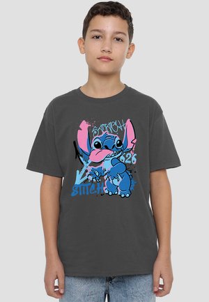 Gray cotton t-shirt featuring a vibrant blue and pink graphic of the character Stitch, with splatter and text designs. Casual fit.