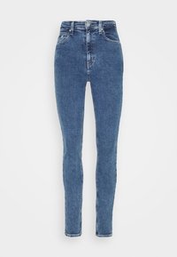 Blå högmidjade skinny jeans med framknapp, bälteslingor, fram- och bakfickor samt blekta tygdetaljer.