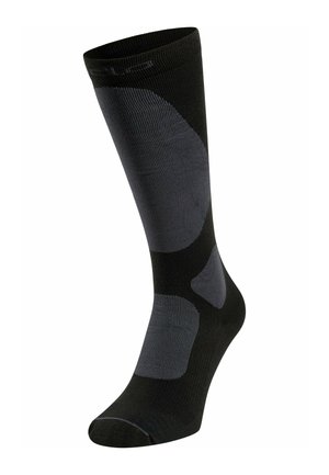 Schwarze Socke mit gerippter Textur, ausgestattet mit dunkelgrauen Akzenten an der Seite und einer verstärkten Ferse, entworfen für Komfort und Langlebigkeit.