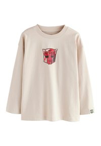 T-shirt a maniche lunghe color beige chiaro realizzata in cotone morbido. Presenta una grafica di un robot rosso sul petto e un piccolo cartellino con il logo sulla manica.