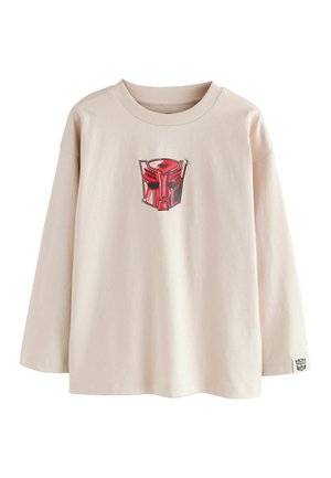 Lys beige langærmet t-shirt lavet af blødt bomuld. Har et rødt robotgrafik på brystet og et lille logo mærke på ærmet.