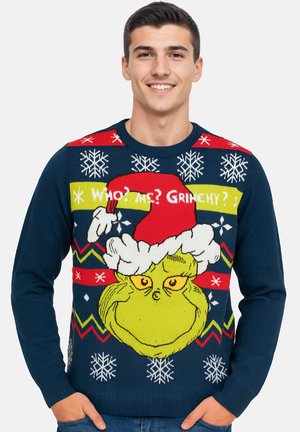 Navy knit sweater featuring a large Grinch graphic with a red and white Santa hat, snowflake motifs, and colorful zigzag patterns.