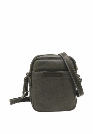 Petit sac bandoulière compact en cuir marron foncé avec poche avant, coutures visibles, fermeture éclair et bandoulière réglable.