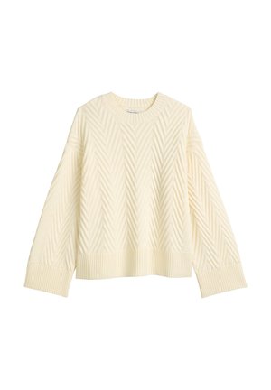 Pull en tricot couleur crème avec un motif en chevrons texturé, encolure arrondie, et poignets et ourlet côtelés. Coupe ample avec des épaules tombantes.