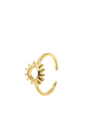 Bague ouverte en or avec un motif en forme de soleil et des rayons pointus autour d'un centre circulaire.