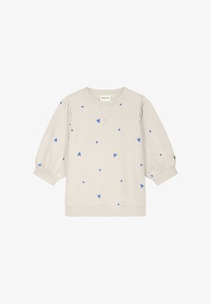 Beige sweater met lange mouwen, blauwe hartjespatronen, ronde halslijn en elastische boorden.