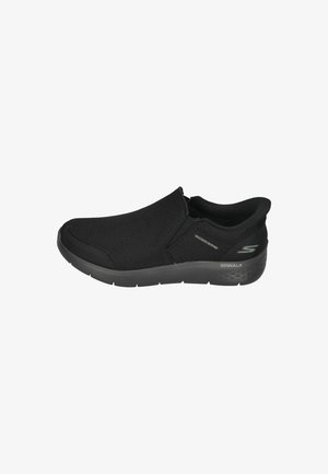 Black slip-on shoe featuring a textured mesh upper, cushioned outsole, and the "S" logo on the side. Suitable for casual wear.