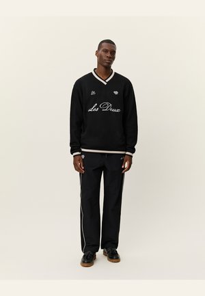 CHASE - Sportska majica - black