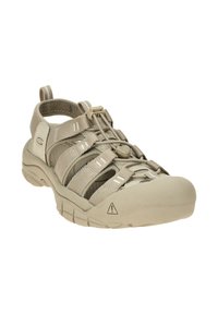 Beige water sandal featuring a rubber toe cap, textile straps with elastic bands, and a quick-lace system on a cushioned sole.