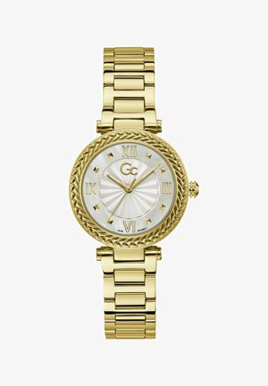Reloj de pulsera en tono dorado con bisel trenzado, esfera de nácar, números romanos y pulsera de eslabones. Incluye movimiento suizo.