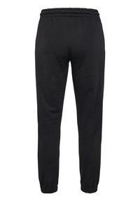 Schwarze Sweatpants aus weichem Stoff, mit elastischem Bund, schmal zulaufenden Beinen und Bündchen an den Knöcheln. Glatte Textur ohne sichtbare Muster.