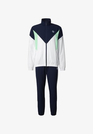 Chándal azul marino y blanco con detalles en verde menta, chaqueta con cremallera y cuello alto, puños elásticos y pantalones a juego con tobillos elásticos.