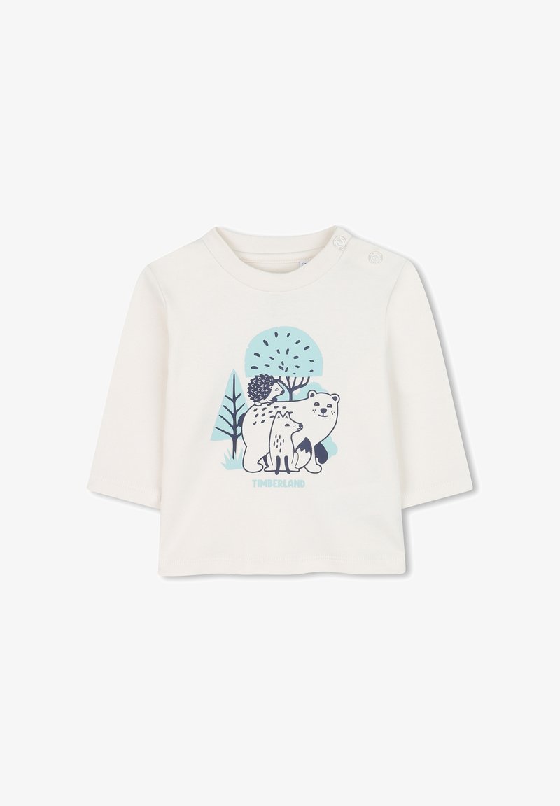 Crème-kleurig overhemd met lange mouwen met een afbeelding van een beer, vos en egel voor blauwe bomen. Voorzien van schouderknoppen voor eenvoudig aankleden.