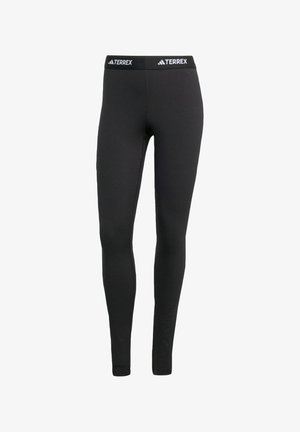 Leggings neri realizzati in tessuto elasticizzato, con un cinturino in marchio TERREX. Il design è aderente senza ulteriori motivi o accenti.