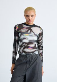 Long-sleeve mesh top in black with multicolored abstract patterns and three black stripes on each arm. Features a round neckline.
