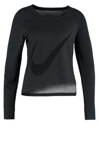 Sweatshirt noir à manches longues avec un logo Nike noir placé de manière proéminente. Il présente un col rond et un ourlet légèrement court. Tissu doux.