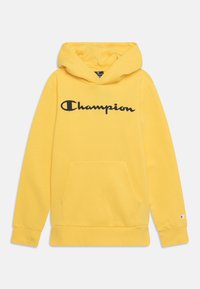 Felpa con cappuccio gialla realizzata in misto cotone. Presenta una tasca frontale, polsini a costine e un logo "Champion" oversize in nero.