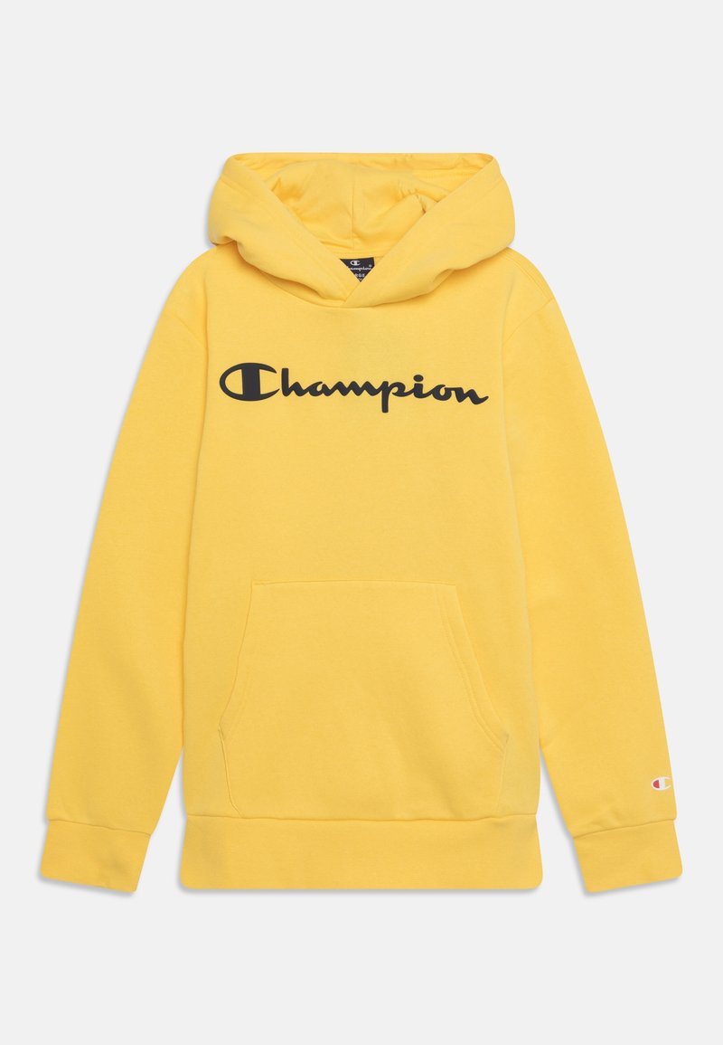 Felpa con cappuccio gialla realizzata in misto cotone. Presenta una tasca frontale, polsini a costine e un logo "Champion" oversize in nero.
