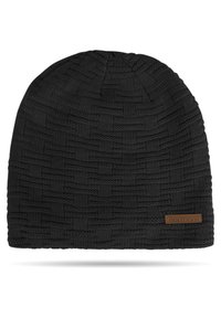 Black knitted beanie with a textured woven pattern; features a brown leather tag on the side with "Normani" embossed. Soft material.