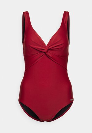 Costume da bagno intero rosso con scollatura profonda a V, design anteriore attorcigliato, spalline larghe e bordo nero a contrasto alle aperture delle gambe.