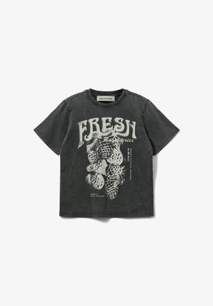 T-shirt en coton gris avec un imprimé graphique d'ananas et le mot "FRESH". Manches courtes, col rond et coupe décontractée.