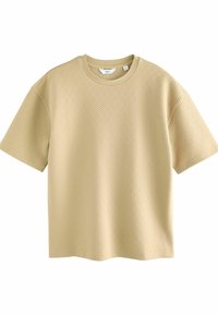 Camiseta de manga corta beige con un patrón texturizado, cuello redondo, corte holgado y dobladillo limpio. Fabricada en una cómoda mezcla de algodón.